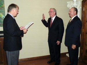 William “Steve” Keith, center, gets sworn in to his position on the SAU Board of Trustees by Columbia County District Court Judge Mike Epley as Ark. Sen. Bruce Maloch looks on.
