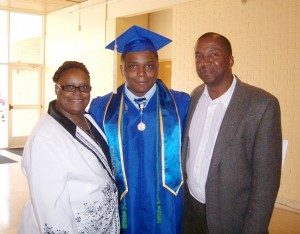 Cameron Sumlin poses for a graduation photo with his parents, Sabrina and Jeffery Sumlin.