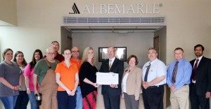 Albemarle Foundation representatives give a check for $60,000 to representatives from Southern Arkansas University for SAU engineering. Pictured, from left, are Albemarle Foundation Magnolia Council members Brinkley Jackson, Lisa Hackenberger, Kimberly Jones, Pat Hammock, Walter Hale, Sara Morris, Bob Stevens, and Lacey Fincher; and from SAU are Dr. David Rankin, Jeanie Bismark, Dr. Scott McKay, Dr. Sam Heintz, and Dr. Mahbub Ahmed.